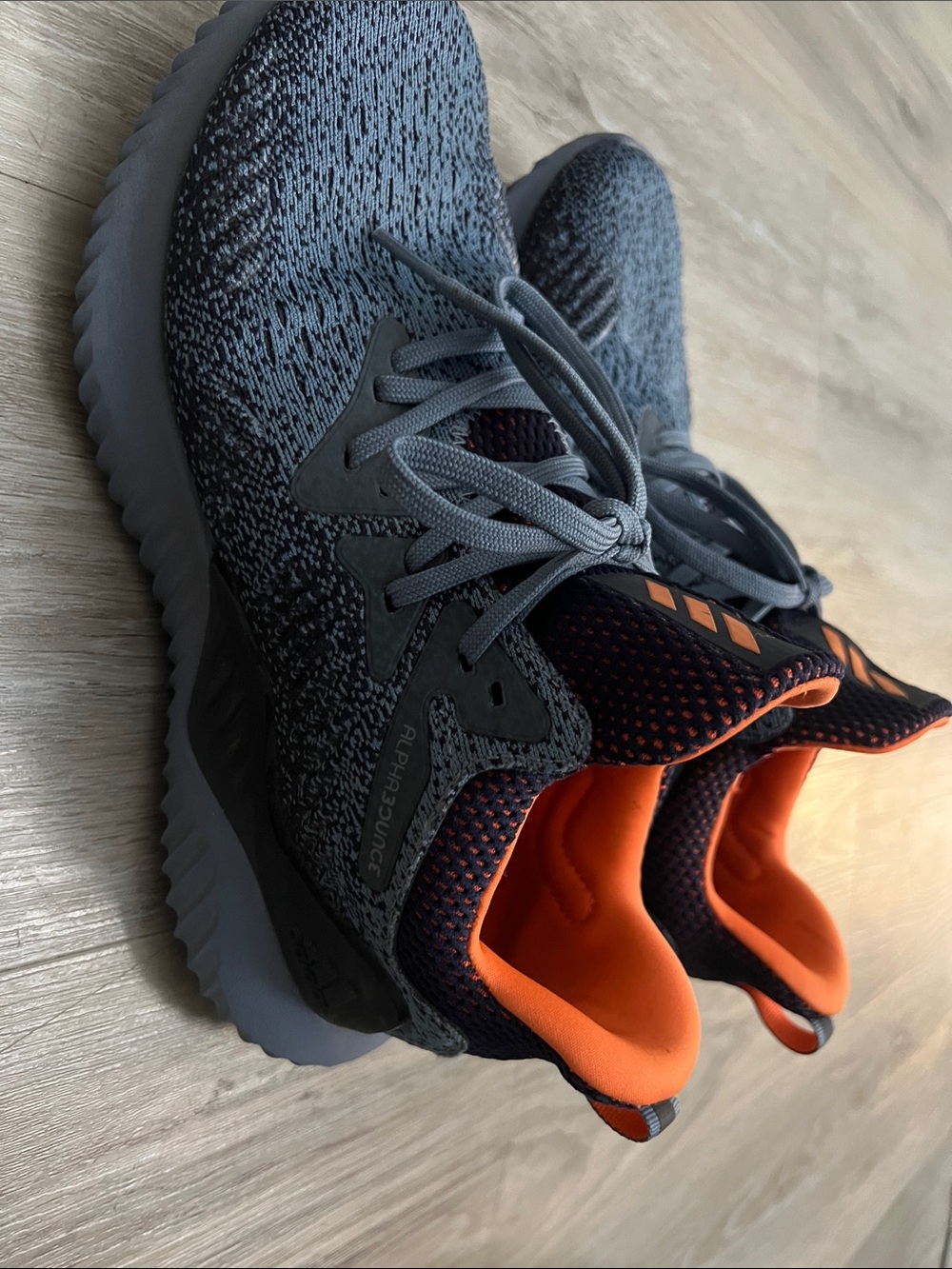 Athletic Shoes with Orange Collar and "BOUNCE"